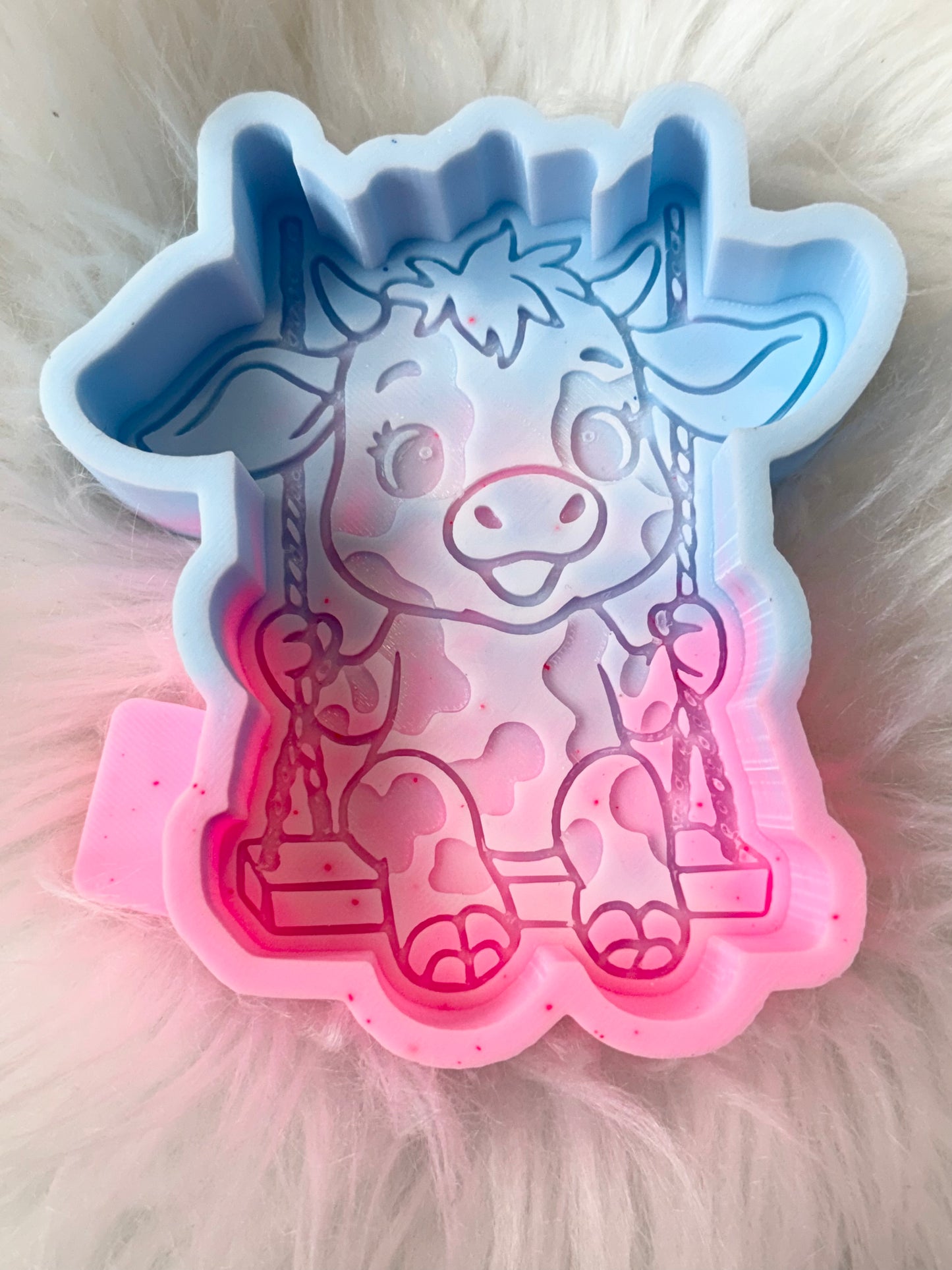 Cow on a swing b grade