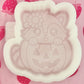 Raccoon in a pumpkin mold