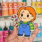 Chucky holding a candy cane freshie